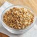 A bowl of Regal Roasted Salted Sunflower Seeds on a table.