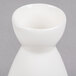 A close up of a white porcelain sake bottle with a small opening.