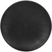 A black plate with a textured circular design.