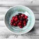 An Elite Global Solutions Monet sea moss melamine bowl filled with cranberries.