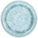 A close up of an Elite Global Solutions Monet sea moss melamine plate with a raised rim and speckled design in blue and green.