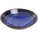 An Elite Global Solutions cobalt blue melamine bowl with black speckles on the rim.