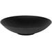 An Elite Global Solutions matte black embossed melamine bowl on a table.