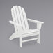A close up of a white POLYWOOD Vineyard Curveback Adirondack chair with armrests.