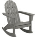 A POLYWOOD slate grey Adirondack rocking chair with armrests.