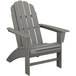 A POLYWOOD gray Adirondack chair with armrests.