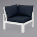 A white POLYWOOD modular corner chair with a blue cushion.