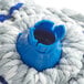 A blue and white microfiber mop head with a blue plastic twist cap.
