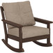 A brown POLYWOOD Vineyard deep seating rocking chair with a beige cushion.