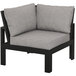 A black and grey POLYWOOD modular corner chair.