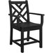 A black POLYWOOD Chippendale outdoor dining arm chair with wooden armrests.