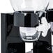 A close-up of a black Zevro double canister dry food dispenser.