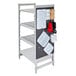 A white Cambro Camshelving® pegboard kit with plastic containers and utensils on it.