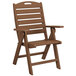 A brown POLYWOOD Nautical folding chair with armrests.