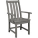 A POLYWOOD slate grey arm chair with armrests.