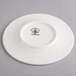 A Homer Laughlin Kensington Ameriwhite bright white china plate with a logo in black.