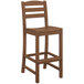A POLYWOOD teak bar side chair with a seat and back.