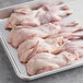 A tray of raw Manchester Farms semi boneless quail.