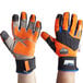 A pair of orange and black Ergodyne ProFlex thermal waterproof work gloves.