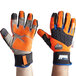 A pair of orange and black Ergodyne ProFlex waterproof work gloves.