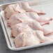 A tray of raw Manchester Farms whole quail.