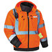 An orange Ergodyne GloWear safety jacket with reflective tape and a phone in the pocket.