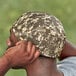 A man wearing a camouflage Ergodyne Chill-Its skull cap.