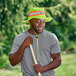 A man wearing an Ergodyne Lime Hi-Vis Ranger Sun Hat and holding a stick.