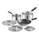 A group of stainless steel Vollrath cookware, including pots and pans with lids.
