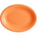 An orange oval Acopa Capri Valencia stoneware platter.