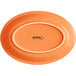 An orange oval Acopa stoneware platter.