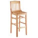 A Lancaster Table & Seating wooden school house bar stool with a backrest.