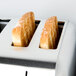 A Waring commercial toaster with two slices of bread toasting.
