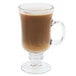 A Libbey Irish glass coffee mug with brown liquid inside.