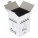 A white box with black straws inside.