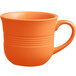 An Acopa Valencia orange stoneware mug with a handle on a white background.