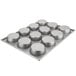 A silver Chicago Metallic mini cake and jumbo muffin pan with 12 cups.