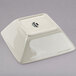 A white square Tuxton china bowl.