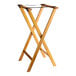 A Lancaster Table & Seating wooden folding tray stand with two legs.