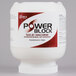 A white container of Noble Chemical Power Block solid machine dish detergent with a red label.