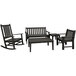 A black POLYWOOD outdoor furniture set with a bench and chairs around a table.