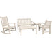 A white POLYWOOD outdoor bench and chair set with a table.