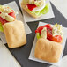 A group of three sandwiches made with Schar Gluten-Free Ciabatta Rolls with cheese and vegetables.