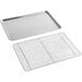 A Baker's Mark aluminum sheet pan with a stainless steel cooling rack on a metal surface.