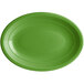 An Acopa Capri palm green oval stoneware coupe platter with a rim.