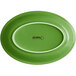 An Acopa Capri palm green stoneware oval platter with a white border.