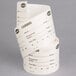 A roll of white paper labels with the words "Cambro StoreSafe" on them.