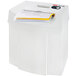 A white HSM Pure 120 paper shredder with papers on top.