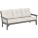 A POLYWOOD Vineyard outdoor sofa in gray with white cushions.