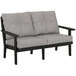 A black and grey POLYWOOD Lakeside loveseat with cushions.